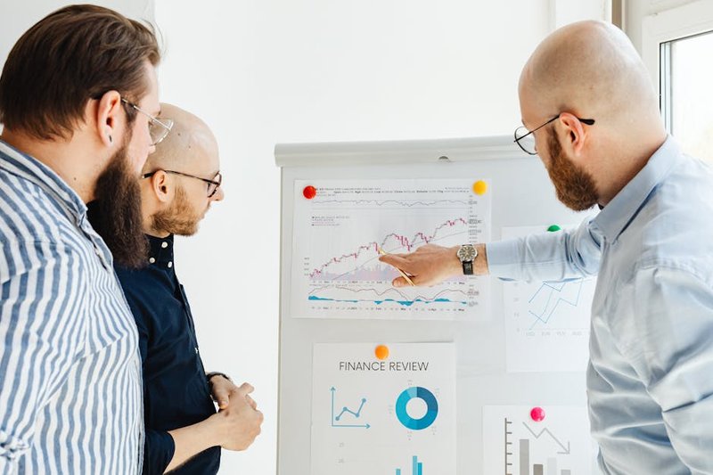 Singapore business owner reviewing analytics - seo geo